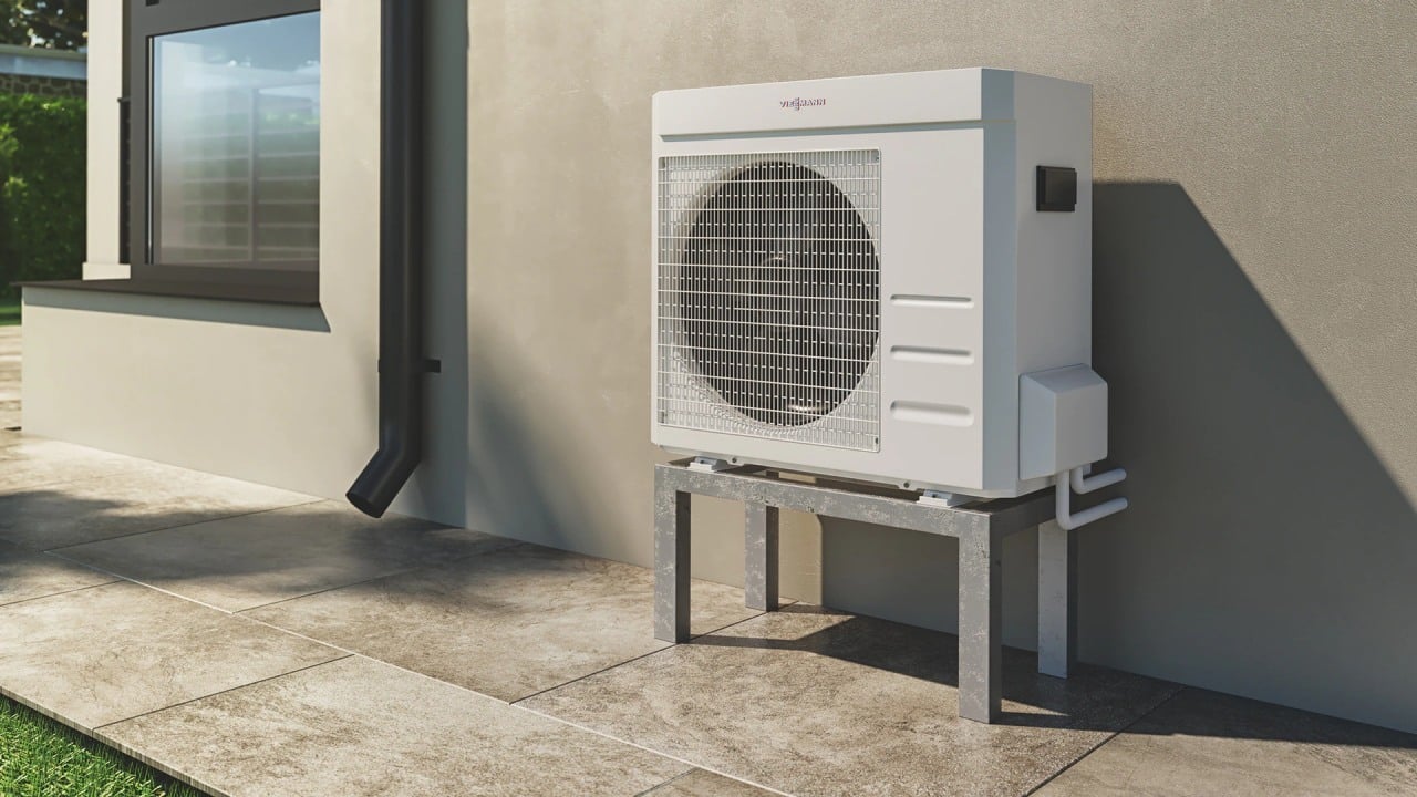 A Viessmann Vitocal 100-A air source heat pump installed outside of a house.